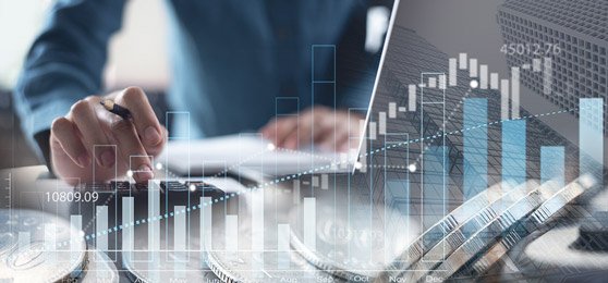 Analysing financial graphs and charts with calculator.