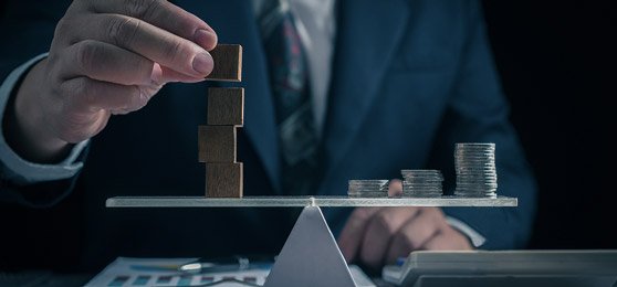 Balancing blocks and coins on a scale