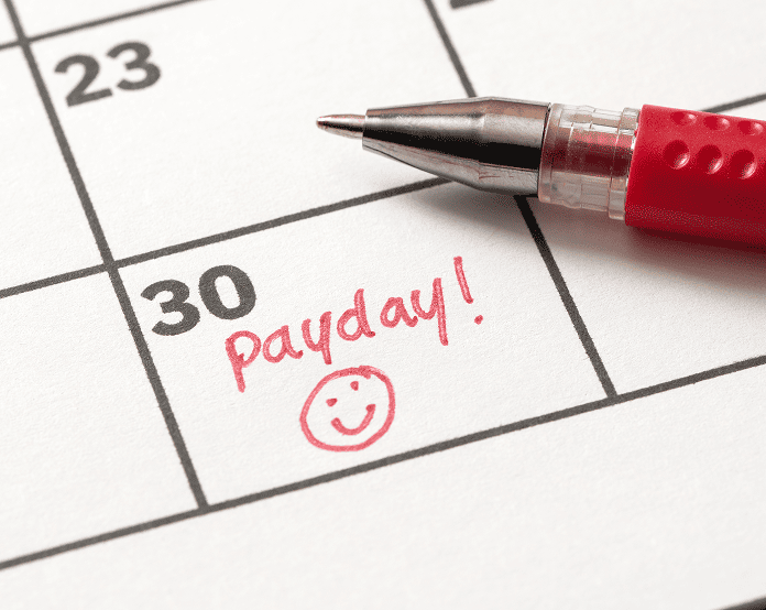 Calendar marked payday with red pen.