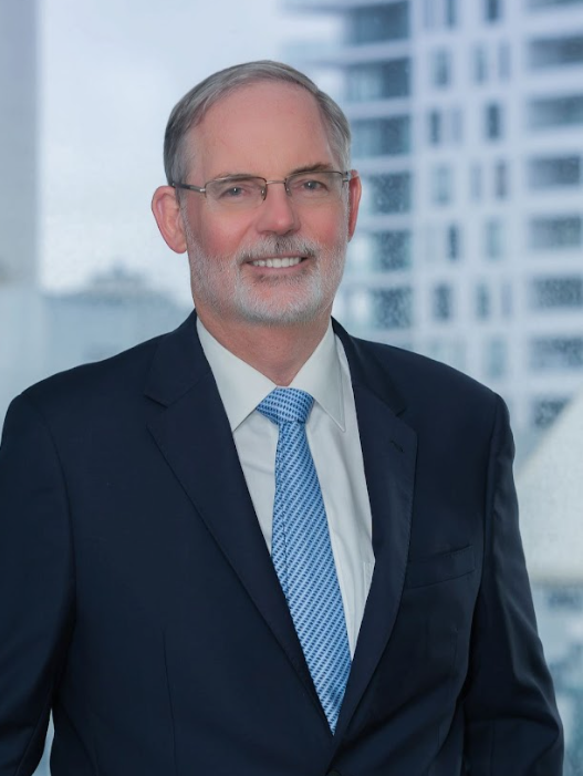 Professional man in suit with city backdrop